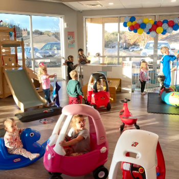 Kids playing with various toys indoors